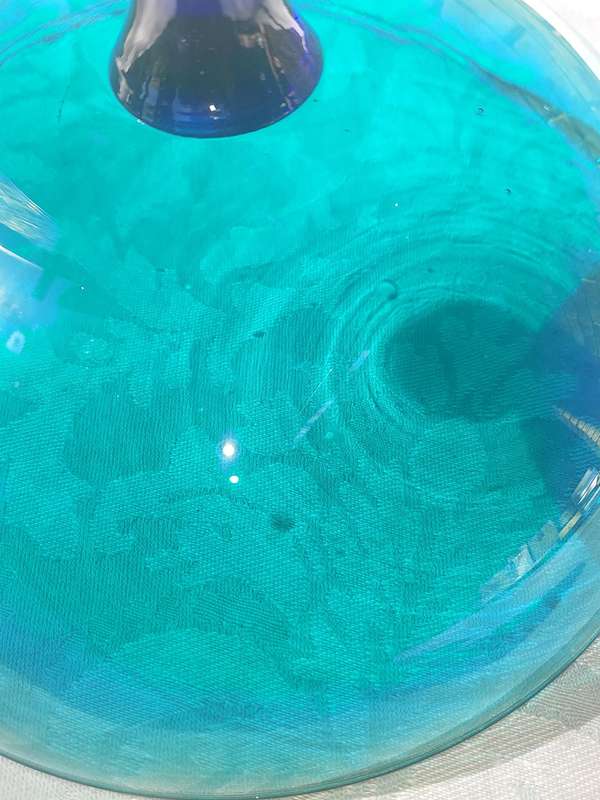 A VINTAGE ART DECOR EXTRA LARGE ICE CREAM COBOLT GREEN AND BLUE FOOTED GLASS BOWL SOLD AS IS