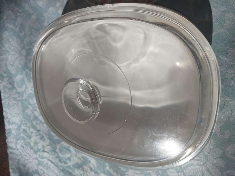 A CORNING WARE CASSEROLE AND A PORCELAIN FLORAL PLATTER SOLD AS IS