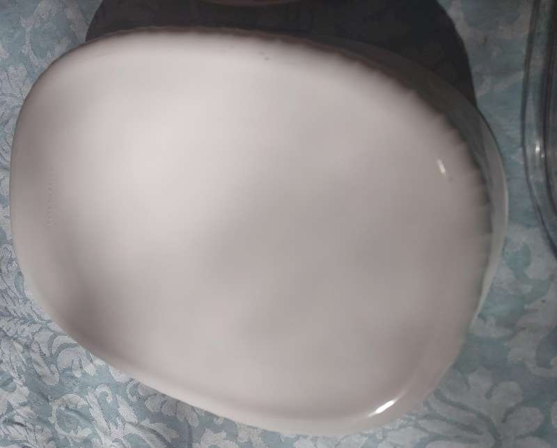 A CORNING WARE CASSEROLE AND A PORCELAIN FLORAL PLATTER SOLD AS IS
