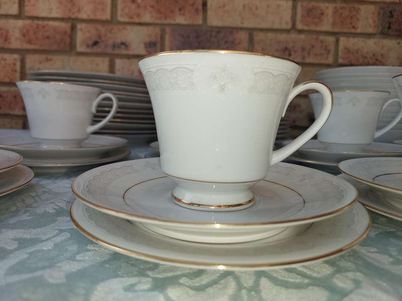 A vintage legendary Sri Lankan Parisian lace Noritake set sold as is