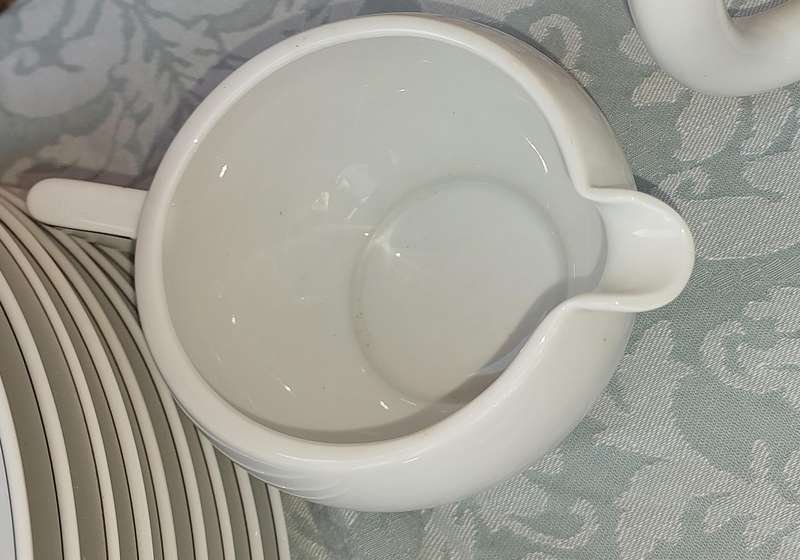 A VINTAGE 47 PIECE WHITE PORCELAIN SET MADE BY ARZBERG GERMANY SOLD AS IS