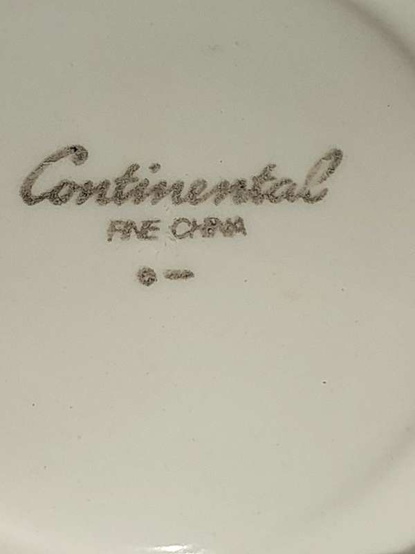 A COLLECTION OF 10 CONTINENTAL SAUCERS WHITE WITH SILVER TRIM AND LIGHT BLUE ART WORK SOLD AS IS