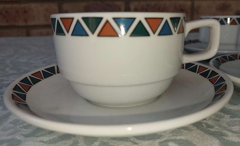 A SET OF CUPS AND SAUCERS BY ROYAL PORCELAIN KINGDOM OF  THAILAND SERIES 02 SOLD AS IS