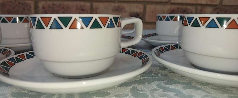 A SET OF CUPS AND SAUCERS BY ROYAL PORCELAIN KINGDOM OF  THAILAND SERIES 02 SOLD AS IS