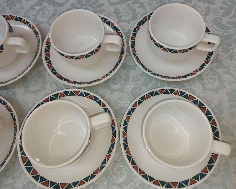 A SET OF CUPS AND SAUCERS BY ROYAL PORCELAIN KINGDOM OF  THAILAND SERIES 02 SOLD AS IS