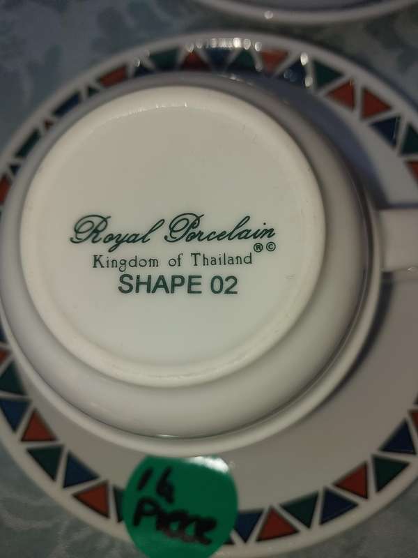 A SET OF CUPS AND SAUCERS BY ROYAL PORCELAIN KINGDOM OF  THAILAND SERIES 02 SOLD AS IS