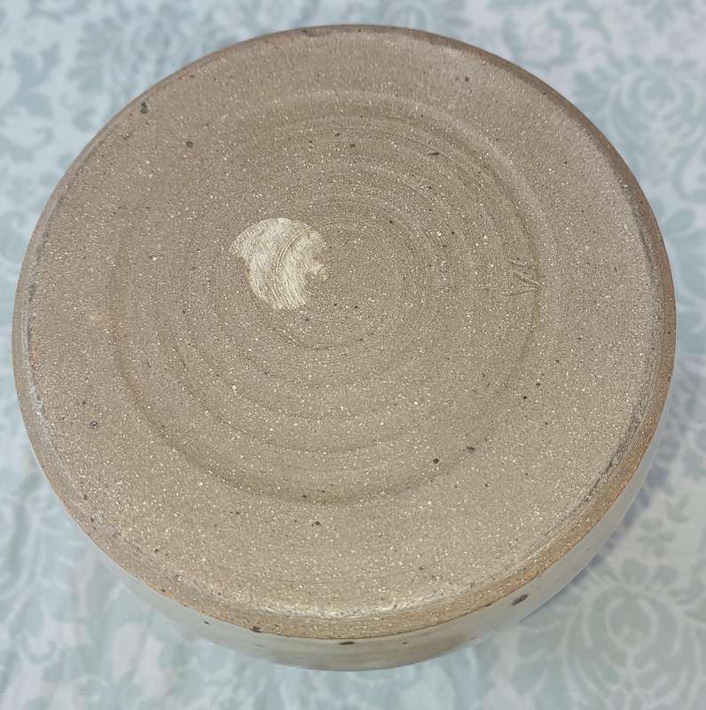A CERAMIC POTTERY OLIVE JAR WITH A LID SOLD AS IS