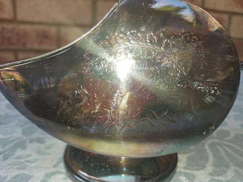 AN ORNATE SILVER PLATE SUGAR SCUTTLE MADE IN SHEFFIELD ENGLAND