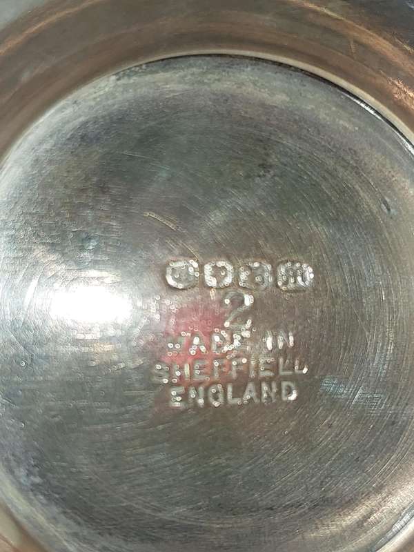 AN ORNATE SILVER PLATE SUGAR SCUTTLE MADE IN SHEFFIELD ENGLAND