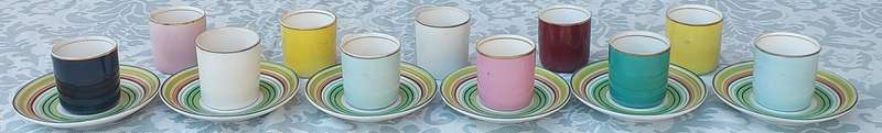 A 17 PIECE DEMATASSE EXPRESSO PORCELAIN CUP AND SAUCER COLECTION SOLD AS IS