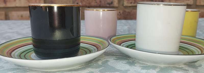 A 17 PIECE DEMATASSE EXPRESSO PORCELAIN CUP AND SAUCER COLECTION SOLD AS IS