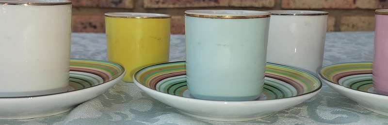 A 17 PIECE DEMATASSE EXPRESSO PORCELAIN CUP AND SAUCER COLECTION SOLD AS IS