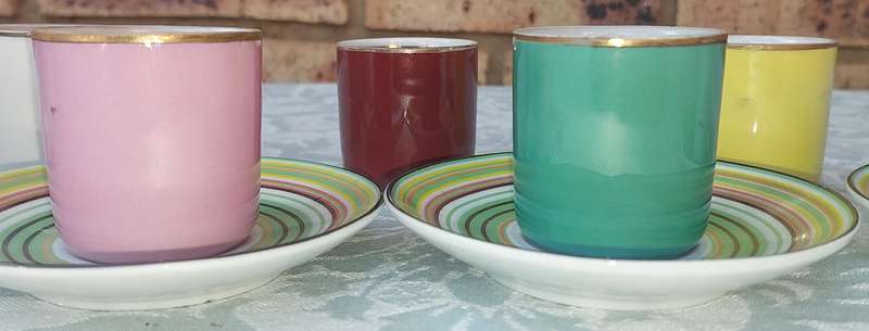 A 17 PIECE DEMATASSE EXPRESSO PORCELAIN CUP AND SAUCER COLECTION SOLD AS IS