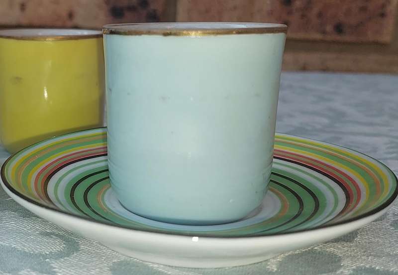 A 17 PIECE DEMATASSE EXPRESSO PORCELAIN CUP AND SAUCER COLECTION SOLD AS IS