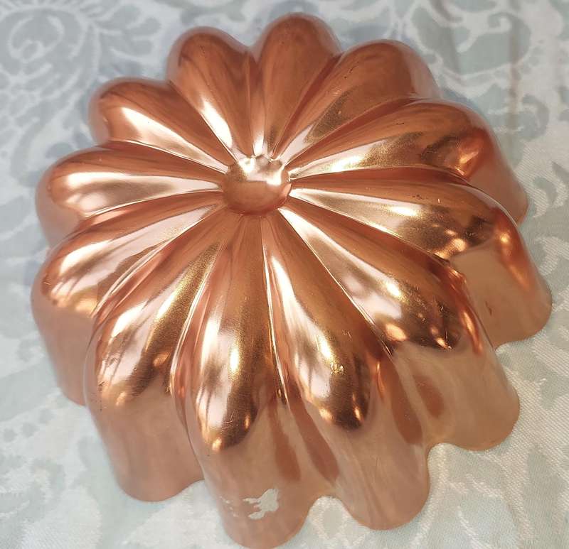 A COLLECTION OIF COPPER BAKING DISHES SOLD AS IS
