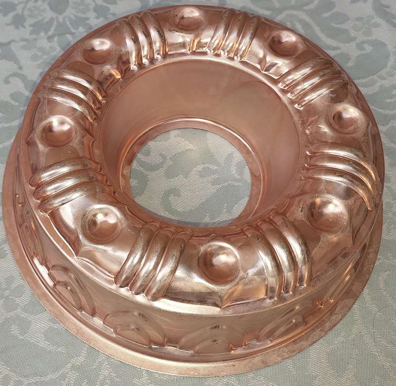 A COLLECTION OIF COPPER BAKING DISHES SOLD AS IS