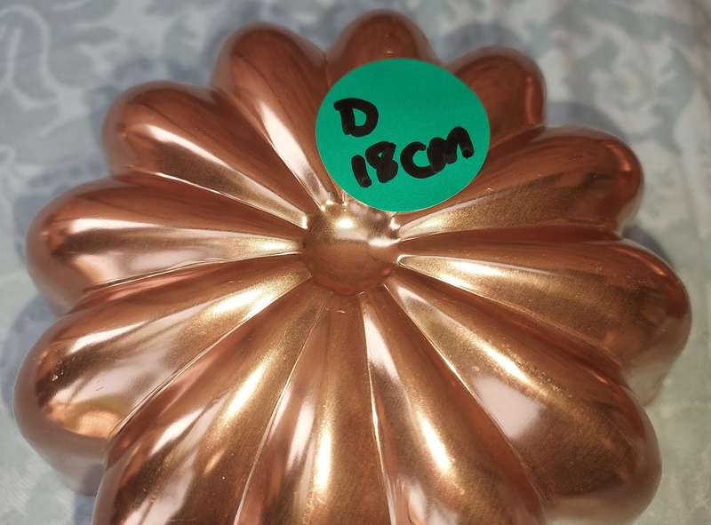 A COLLECTION OIF COPPER BAKING DISHES SOLD AS IS