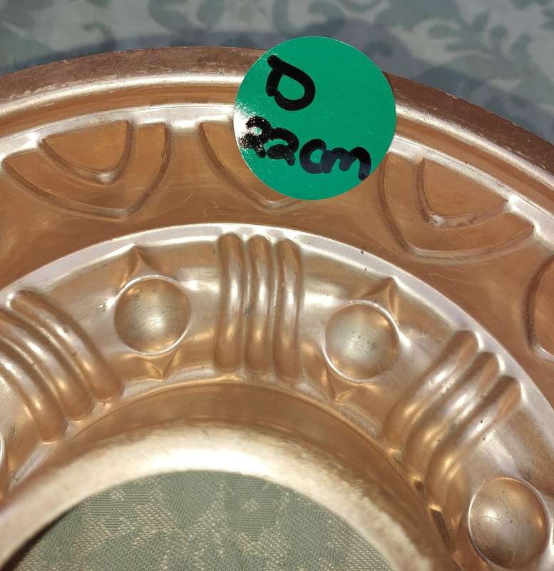 A COLLECTION OIF COPPER BAKING DISHES SOLD AS IS