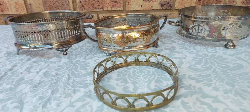 A COLLECTION OF VINTAGE SILVER PLATED CADDY BASKETS SOLD AS IS