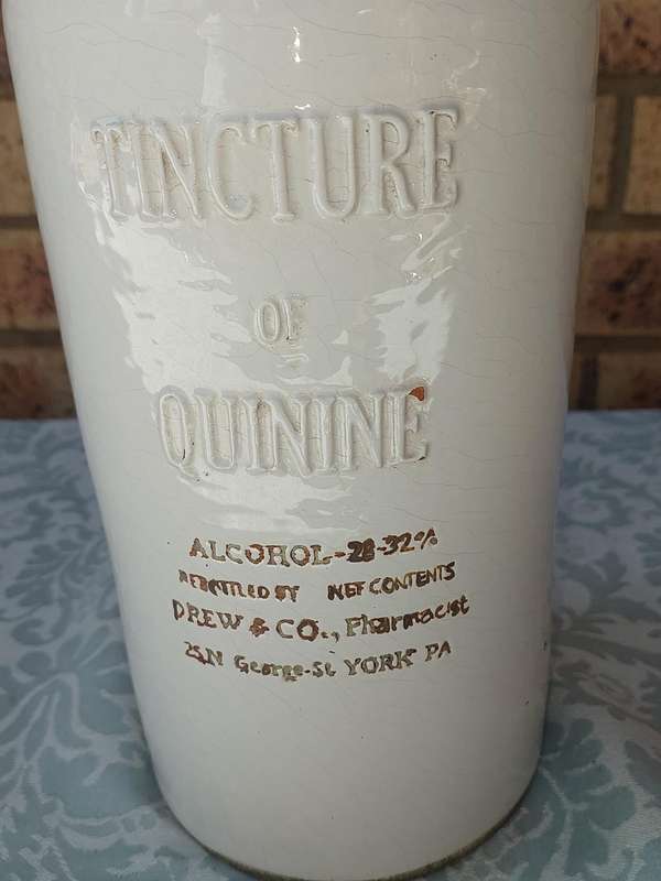 AN ANTIQUE CARA MIA STONEWARE ALCOHOL BOTTLE SOOD AS IS