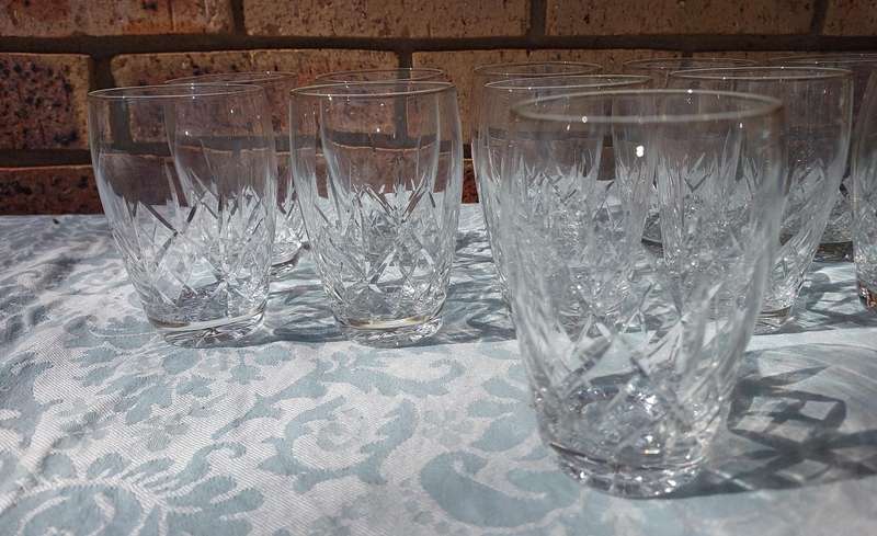 A SET OF 11 CRYSTAL GLASSES SOLD AS IS