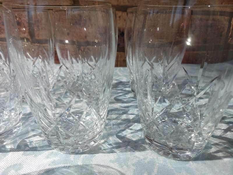 A SET OF 11 CRYSTAL GLASSES SOLD AS IS