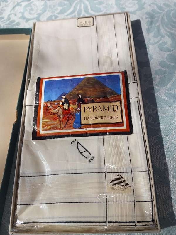 A VINTAGE UNUSED PYRAMID HANDKERCHIEF SOLD AS IS