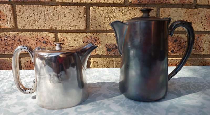 TWO ANTIQUE SOUTH AFRICAN RAILWAYS SERVING JUGS SOLD AS IS