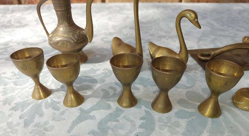 A COLLECTION OF BRASS FIGURINES AND UTENSILS SOLD AS IS