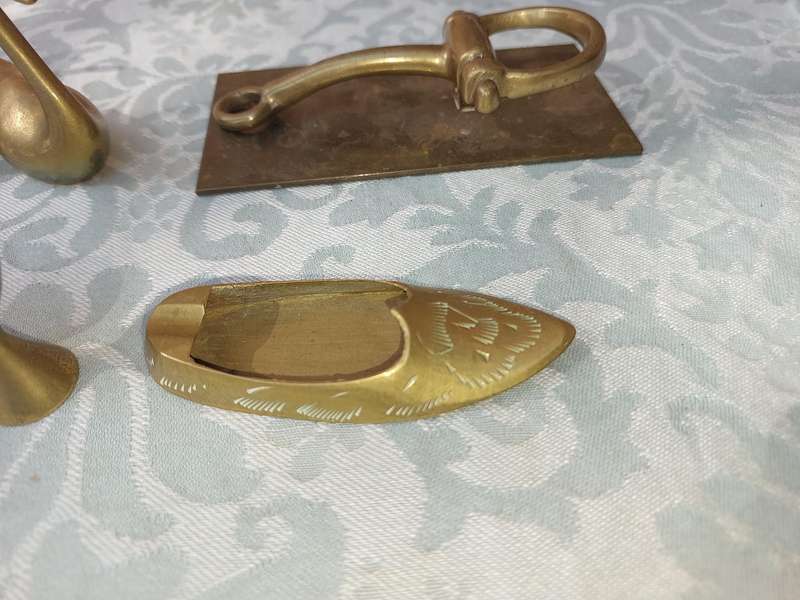 A COLLECTION OF BRASS FIGURINES AND UTENSILS SOLD AS IS