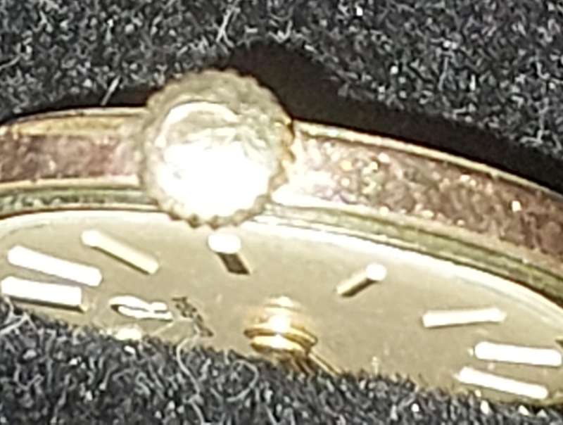 A VINTAGE OMEGA SWISS CALIBRE 620 MACHINISM WITH THE CROWN SERIAL NUMBER 1822323
