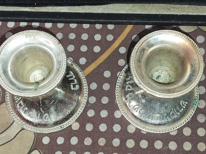 A PAIR OF JUDAICA CANDLE HOLER SILVER PLATED SOLD AS IS