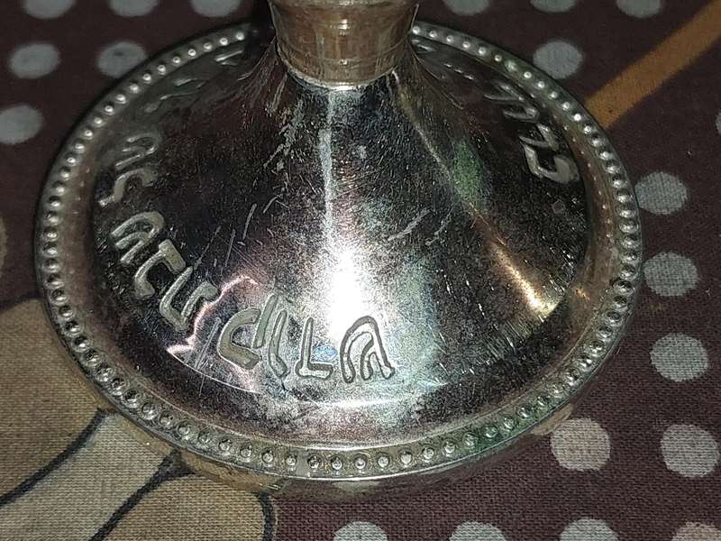 A PAIR OF JUDAICA CANDLE HOLER SILVER PLATED SOLD AS IS