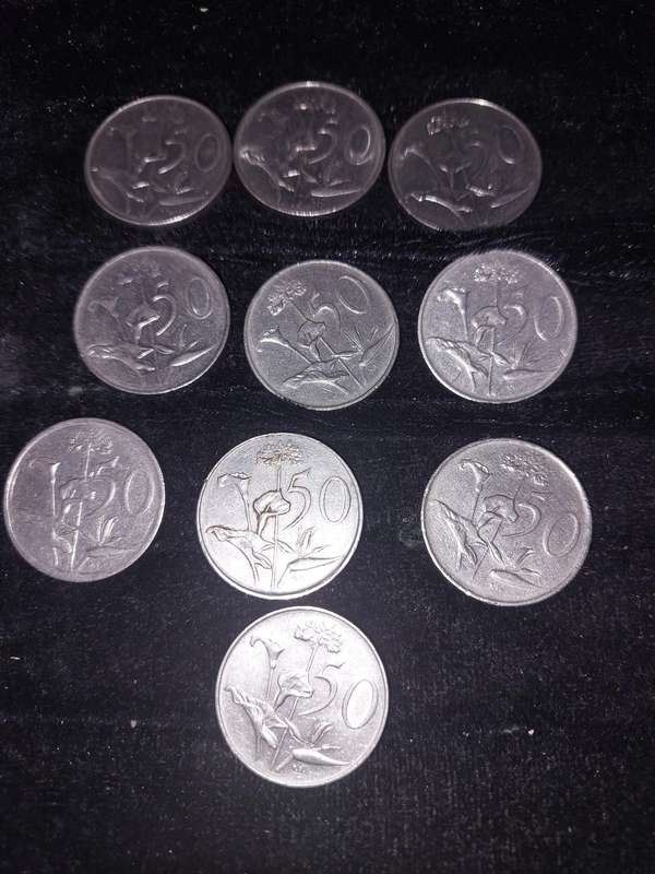 A COLLECTION OF 10 VINTAGE  SOUTH AFRICAN 50 CENTS COINS SOLD AS IS