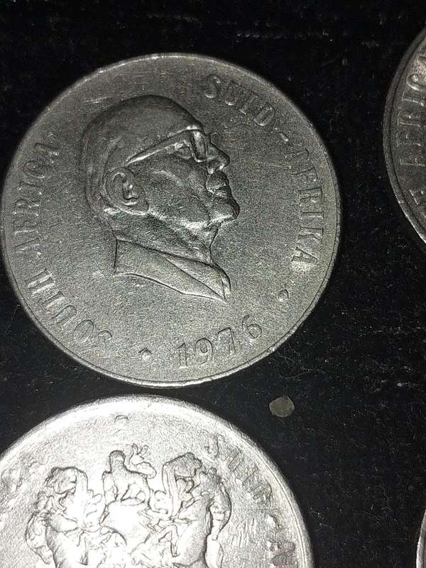 A COLLECTION OF 10 VINTAGE  SOUTH AFRICAN 50 CENTS COINS SOLD AS IS