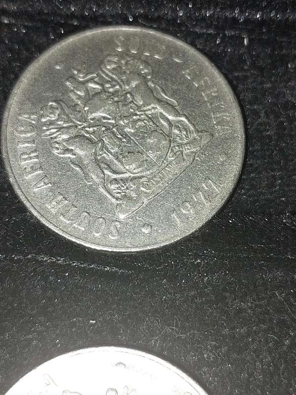 A COLLECTION OF 10 VINTAGE  SOUTH AFRICAN 50 CENTS COINS SOLD AS IS