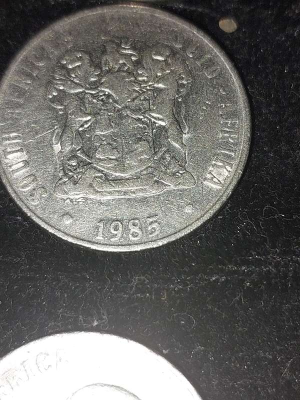 A COLLECTION OF 10 VINTAGE  SOUTH AFRICAN 50 CENTS COINS SOLD AS IS