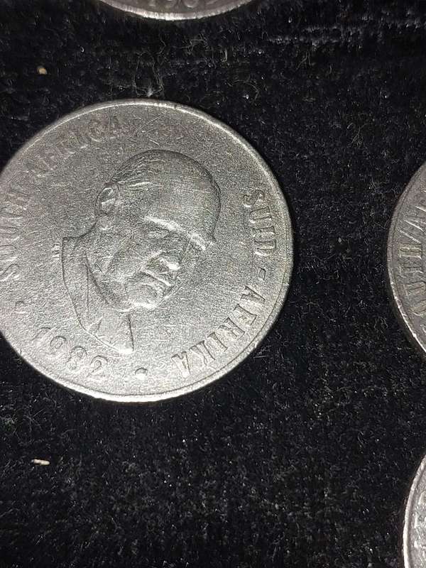 A COLLECTION OF 10 VINTAGE  SOUTH AFRICAN 50 CENTS COINS SOLD AS IS