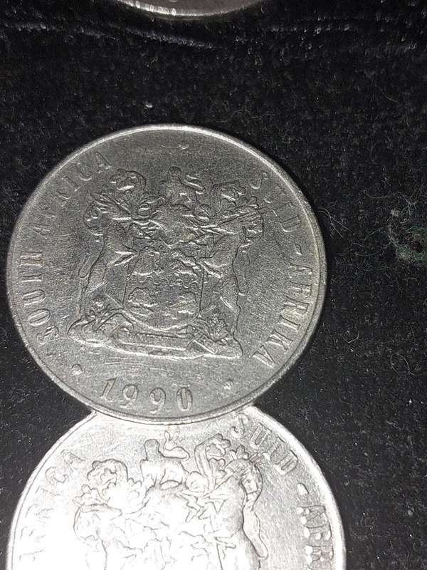 A COLLECTION OF 10 VINTAGE  SOUTH AFRICAN 50 CENTS COINS SOLD AS IS