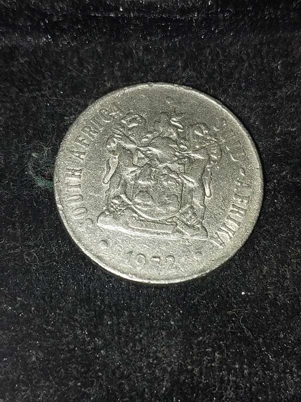 A COLLECTION OF 10 VINTAGE  SOUTH AFRICAN 50 CENTS COINS SOLD AS IS