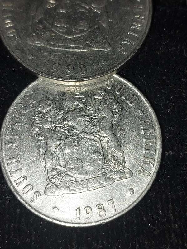 A COLLECTION OF 10 VINTAGE  SOUTH AFRICAN 50 CENTS COINS SOLD AS IS