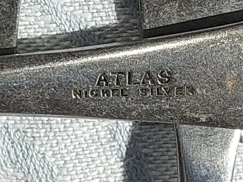 AN ANTIQUE SET OF ATLAS NICKLE SILVER FISH KNIVES SOLD AS IS