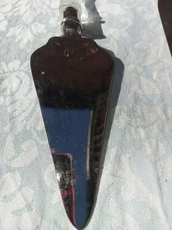 AN ART DECOR CAKE CUTTING SET CUTLERY SOLD AS IS