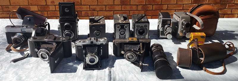 AN ANTIQUE COLLECTION CAMERAS SOLD AS IS