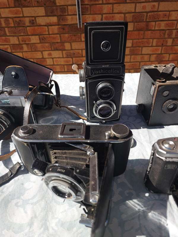 AN ANTIQUE COLLECTION CAMERAS SOLD AS IS