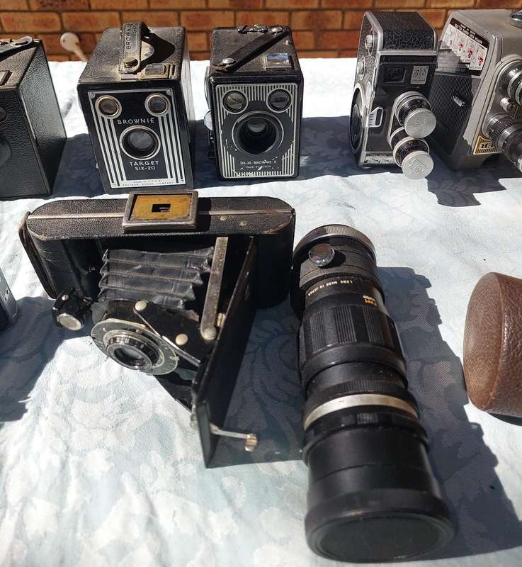 AN ANTIQUE COLLECTION CAMERAS SOLD AS IS