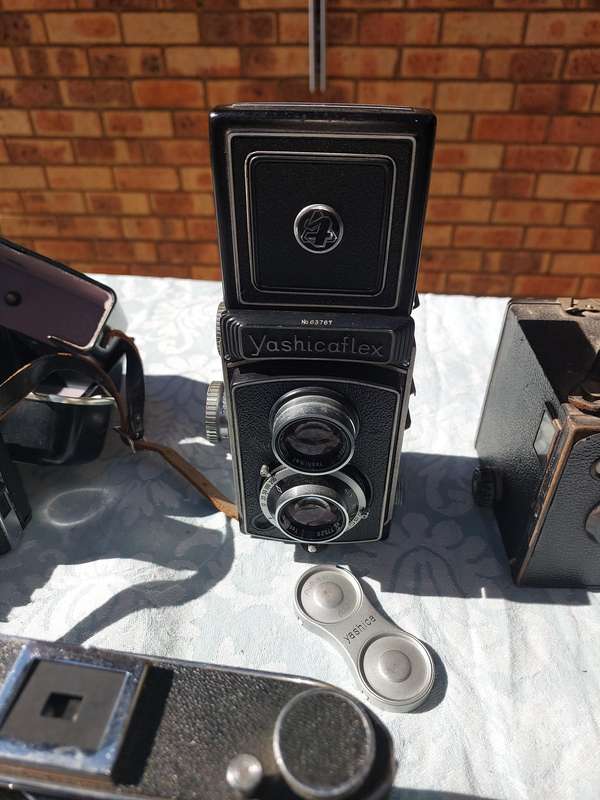 AN ANTIQUE COLLECTION CAMERAS SOLD AS IS