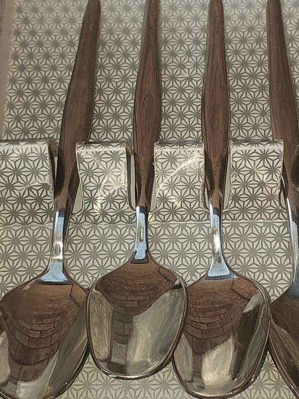 A VINTAGE SET OF 188 STAINLESS STEEL DEMARTESE SPOONS SOLD AS IS