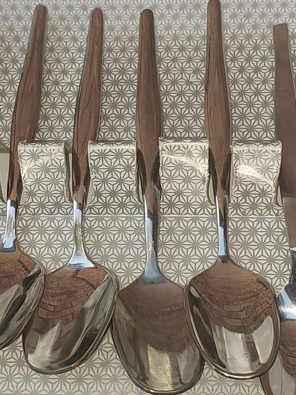 A VINTAGE SET OF 188 STAINLESS STEEL DEMARTESE SPOONS SOLD AS IS