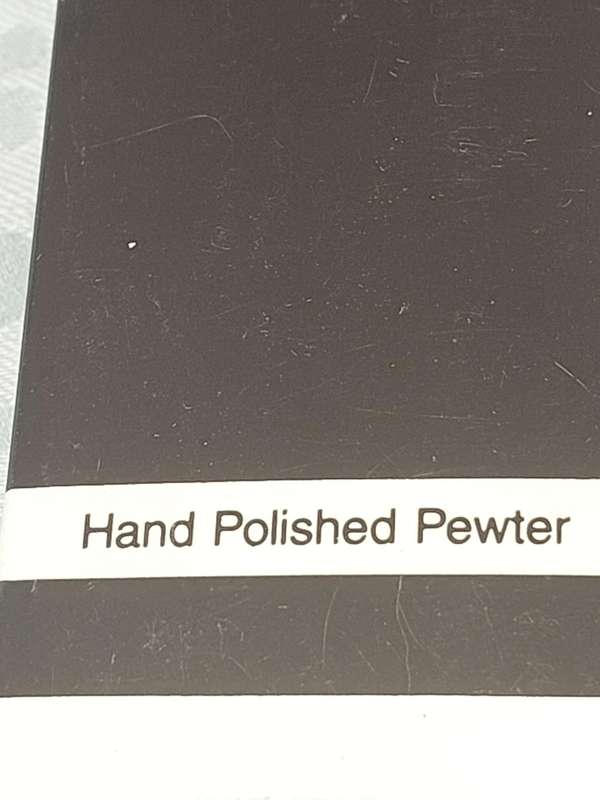 A METAL ART POLISHED PEWTER CHEESE CUTTER SOLD AS IS